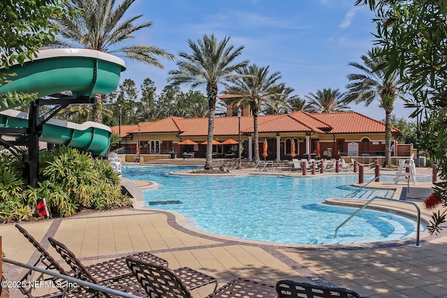 219 Heron Landing Rd, Saint Johns, FL 32259 - community pool with a water slide and a patio area
