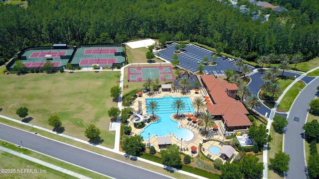 219 Heron Landing Rd, Saint Johns, FL 32259 - bird's eye view of a pool area and a heavily wooded area