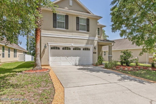 680 Briar View Dr, Orange Park, FL 32065 - traditional-style home featuring driveway, an attached garage, and stucco siding