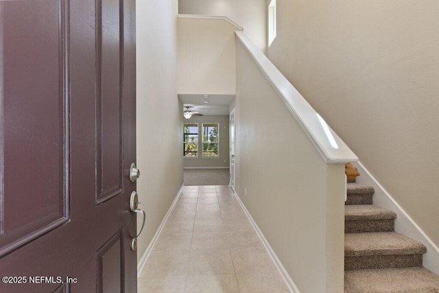680 Briar View Dr, Orange Park, FL 32065 - foyer entrance with light tile patterned flooring, stairway, and baseboards