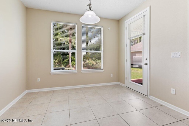 680 Briar View Dr, Orange Park, FL 32065 - unfurnished dining area featuring healthy amount of natural light, baseboards, and light tile patterned floors