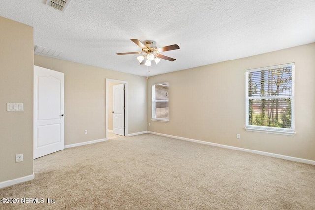680 Briar View Dr, Orange Park, FL 32065 - carpeted spare room featuring a ceiling fan, baseboards, and a textured ceiling