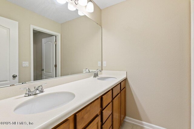 680 Briar View Dr, Orange Park, FL 32065 - full bath with double vanity, baseboards, and tile patterned flooring
