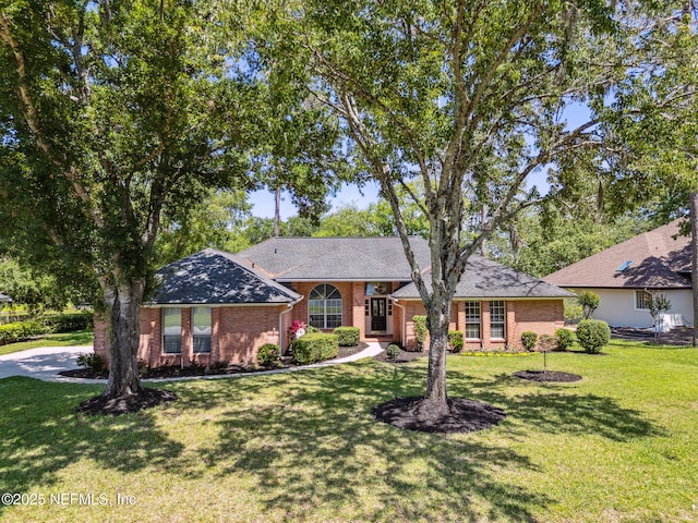 1553 Royal Fern Ln, Fleming Island, FL 32003 - single story home featuring a front yard and brick siding