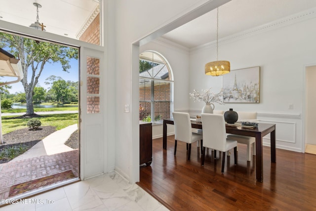 1553 Royal Fern Ln, Fleming Island, FL 32003 - dining space featuring a chandelier, a water view, and ornamental molding