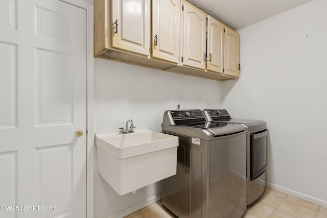 1553 Royal Fern Ln, Fleming Island, FL 32003 - laundry room featuring washer and dryer, cabinet space, baseboards, light tile patterned floors, and a textured ceiling