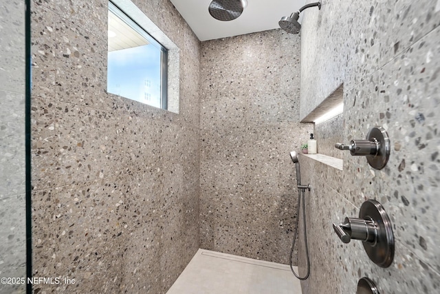 full bathroom featuring tiled shower