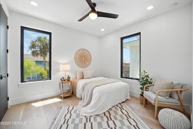 bedroom with recessed lighting, light wood finished floors, and a ceiling fan