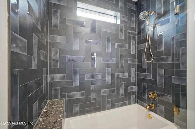bathroom featuring washtub / shower combination