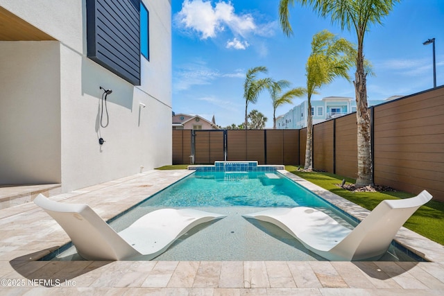 view of swimming pool with a fenced backyard