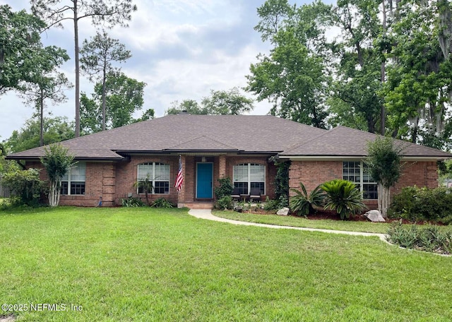1734 Alps Ct, Fleming Island, FL 32003 - ranch-style home with brick siding, a front lawn, and a shingled roof