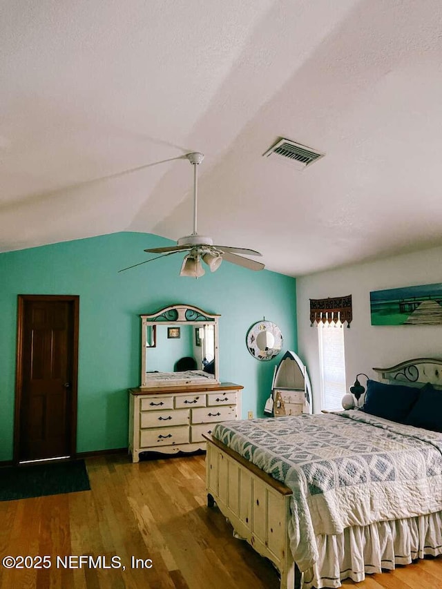 1734 Alps Ct, Fleming Island, FL 32003 - bedroom with wood finished floors, a ceiling fan, and vaulted ceiling