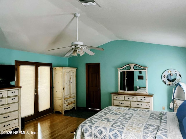 1734 Alps Ct, Fleming Island, FL 32003 - bedroom with vaulted ceiling, dark wood-style flooring, ceiling fan, and access to exterior