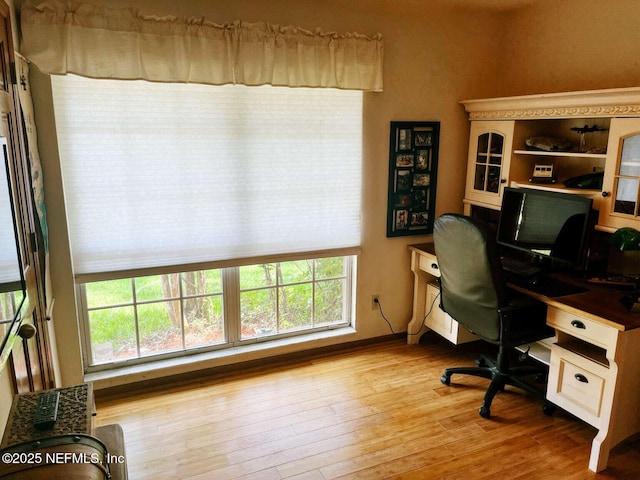 1734 Alps Ct, Fleming Island, FL 32003 - office area with healthy amount of natural light and wood finished floors