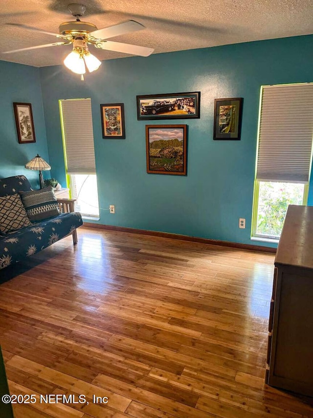 1734 Alps Ct, Fleming Island, FL 32003 - living room featuring hardwood / wood-style flooring, a textured ceiling, healthy amount of natural light, and a ceiling fan