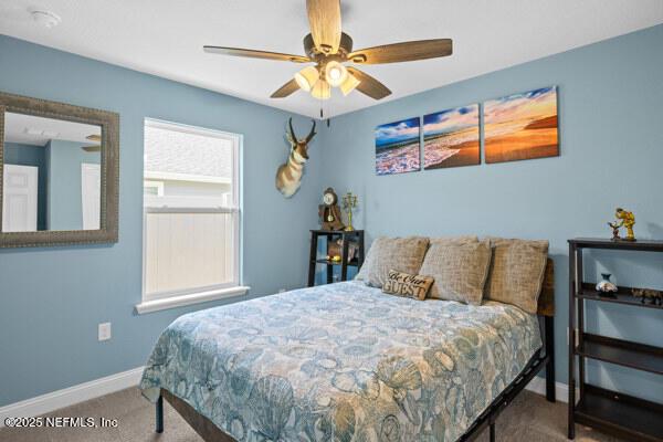 2768 Windsor Lakes Way, Green Cove Springs, FL 32043 - bedroom with carpet, baseboards, and ceiling fan