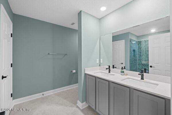 2768 Windsor Lakes Way, Green Cove Springs, FL 32043 - full bath featuring a shower stall, baseboards, double vanity, and tile patterned flooring