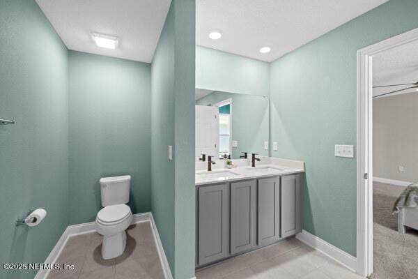 2768 Windsor Lakes Way, Green Cove Springs, FL 32043 - bathroom with toilet, double vanity, baseboards, and tile patterned flooring