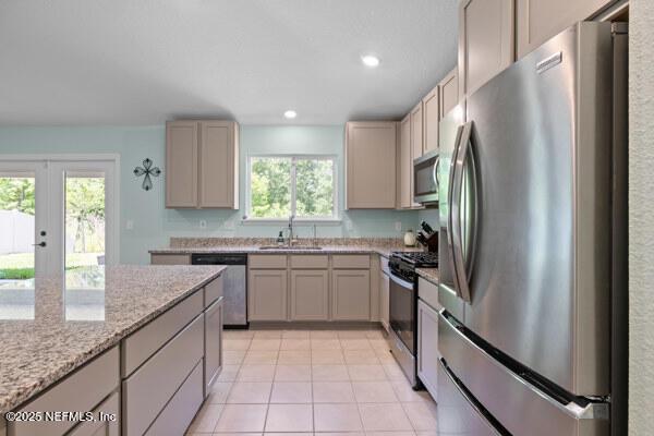 2768 Windsor Lakes Way, Green Cove Springs, FL 32043 - kitchen with appliances with stainless steel finishes, healthy amount of natural light, a sink, light tile patterned floors, and recessed lighting