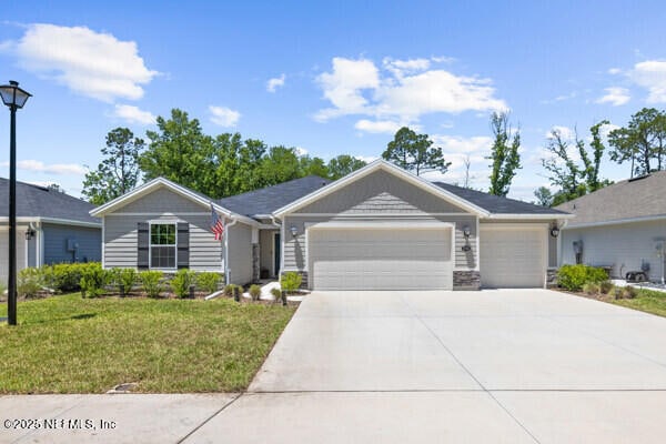 2768 Windsor Lakes Way, Green Cove Springs, FL 32043 - ranch-style house featuring a garage, driveway, and a front yard