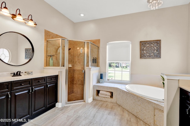 3854 Painted Bunting Way, Jacksonville, FL 32224 - full bath featuring vanity, a bath, a stall shower, and recessed lighting