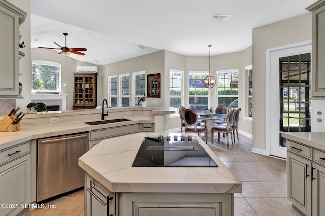 3854 Painted Bunting Way, Jacksonville, FL 32224 - kitchen with dishwasher, a sink, black electric stovetop, light tile patterned floors, and a ceiling fan
