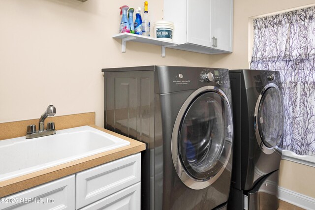 3854 Painted Bunting Way, Jacksonville, FL 32224 - laundry room with washer and dryer and cabinet space