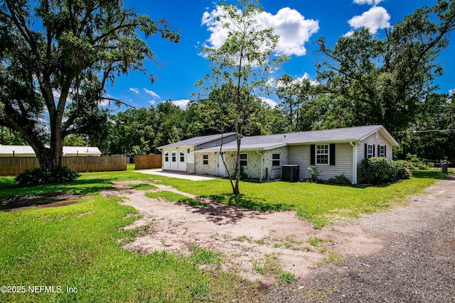 54038 Charles St, Callahan, FL 32011 - back of property featuring dirt driveway and a patio