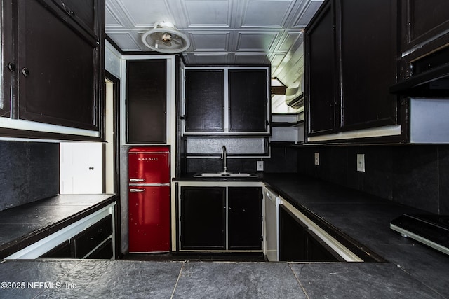 54038 Charles St, Callahan, FL 32011 - kitchen with dark cabinetry, dark countertops, an ornate ceiling, and tasteful backsplash