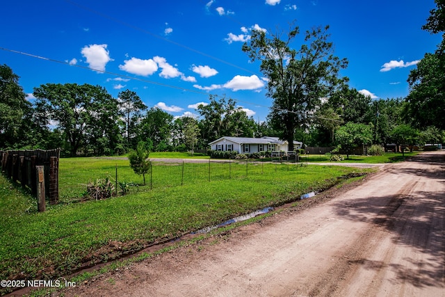 54038 Charles St, Callahan, FL 32011 - view of dirt / gravel road featuring view of wooded area