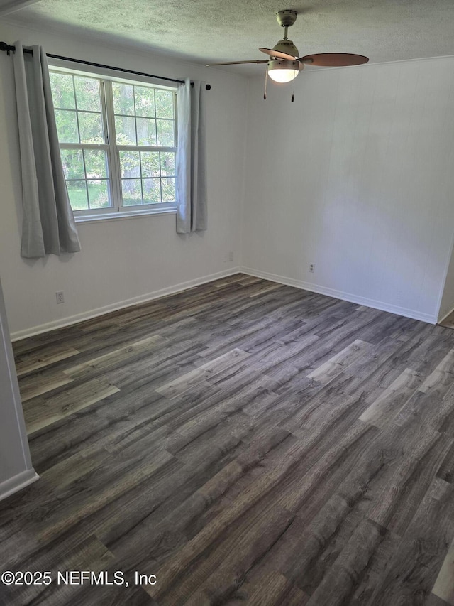 54038 Charles St, Callahan, FL 32011 - unfurnished room with a textured ceiling, ceiling fan, and dark wood-type flooring