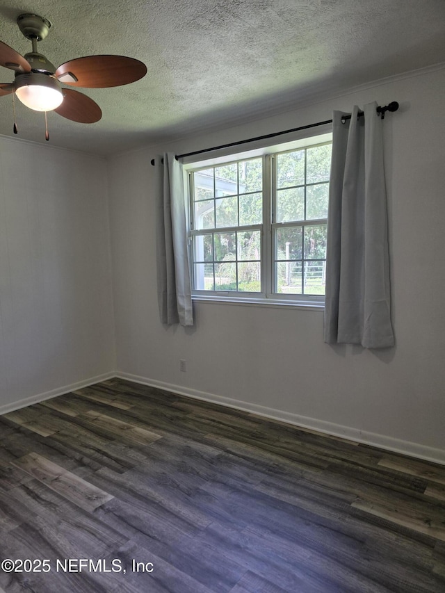 54038 Charles St, Callahan, FL 32011 - spare room featuring a ceiling fan, dark wood-type flooring, and a textured ceiling