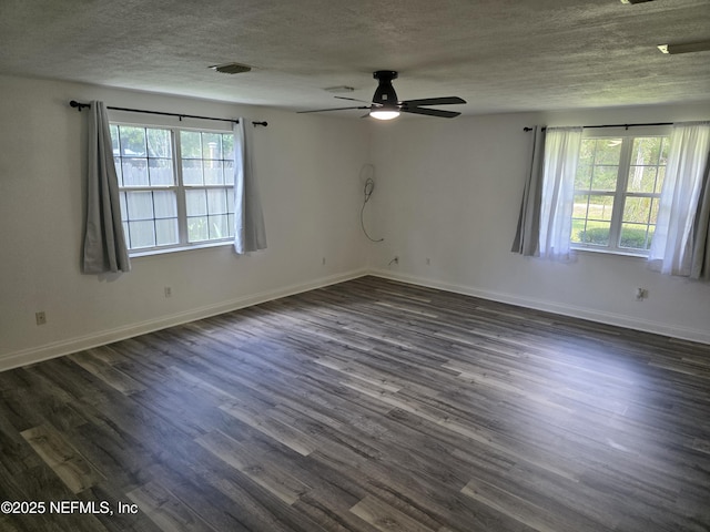 54038 Charles St, Callahan, FL 32011 - empty room with a textured ceiling, ceiling fan, and dark wood finished floors