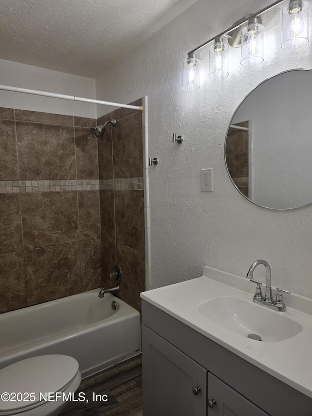 54038 Charles St, Callahan, FL 32011 - bathroom with vanity, a textured wall, bathtub / shower combination, wood finished floors, and a textured ceiling