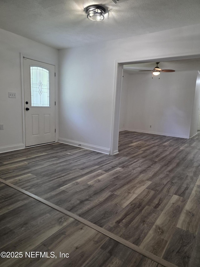 54038 Charles St, Callahan, FL 32011 - entrance foyer with dark wood-style flooring, ceiling fan, and a textured ceiling