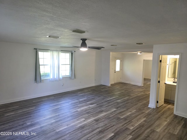 54038 Charles St, Callahan, FL 32011 - unfurnished room featuring healthy amount of natural light, ceiling fan, dark wood-type flooring, and a textured ceiling
