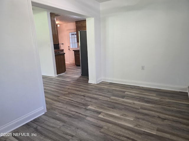 54038 Charles St, Callahan, FL 32011 - unfurnished room featuring dark wood-style flooring and baseboards