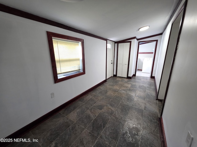54038 Charles St, Callahan, FL 32011 - spare room with baseboards and dark stone finish floors