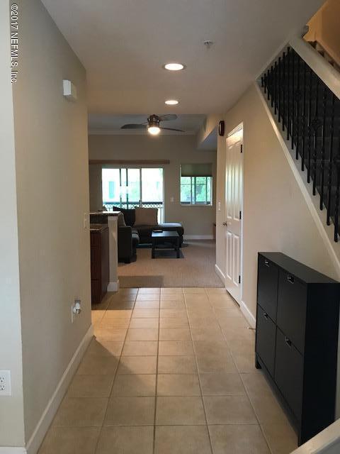 9745 Touchton Rd Unit 2522, Jacksonville, FL 32246 - corridor with light tile patterned flooring, baseboards, recessed lighting, and stairway