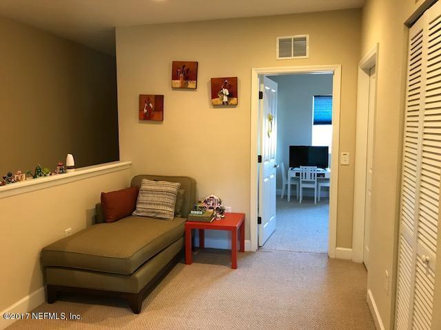 9745 Touchton Rd Unit 2522, Jacksonville, FL 32246 - hallway with light colored carpet and baseboards