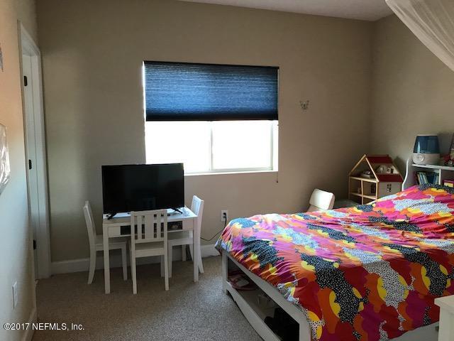 9745 Touchton Rd Unit 2522, Jacksonville, FL 32246 - bedroom featuring carpet floors and baseboards