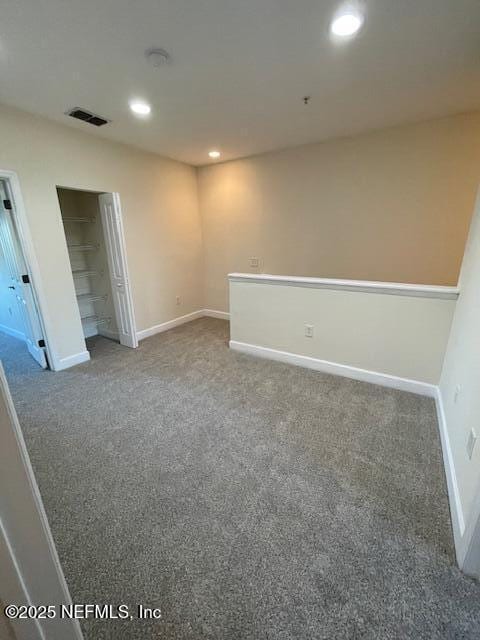 9745 Touchton Rd Unit 2522, Jacksonville, FL 32246 - spare room featuring carpet floors, baseboards, recessed lighting, and a smoke detector