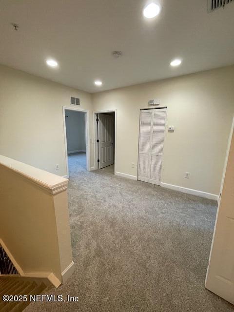 9745 Touchton Rd Unit 2522, Jacksonville, FL 32246 - unfurnished room featuring baseboards, light carpet, recessed lighting, and fire sprinkler in ceiling