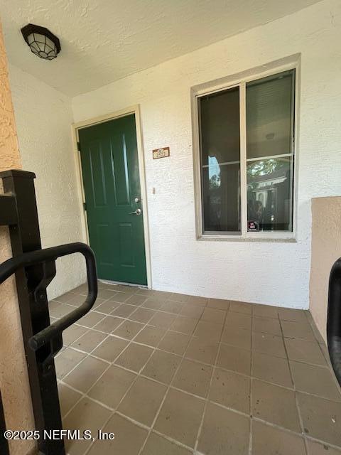 9745 Touchton Rd Unit 2522, Jacksonville, FL 32246 - doorway to property featuring stucco siding