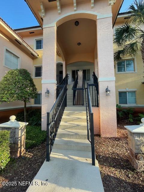 9745 Touchton Rd Unit 2522, Jacksonville, FL 32246 - property entrance with stucco siding