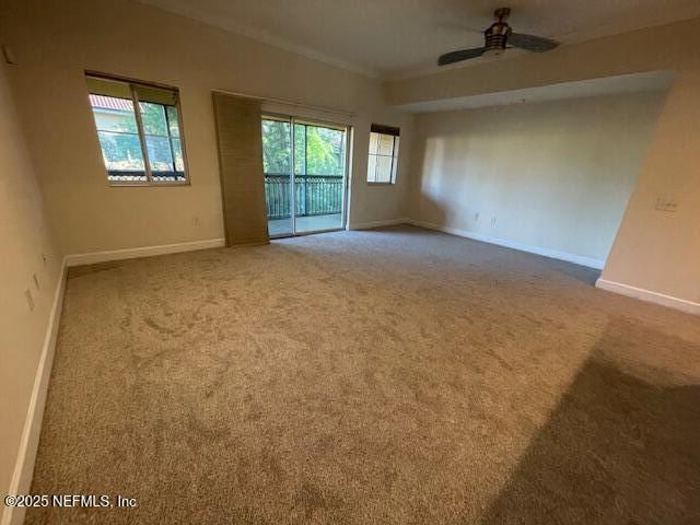 9745 Touchton Rd Unit 2522, Jacksonville, FL 32246 - empty room featuring ornamental molding, carpet floors, baseboards, and a ceiling fan