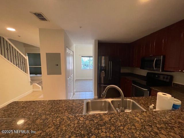 9745 Touchton Rd Unit 2522, Jacksonville, FL 32246 - kitchen featuring stainless steel appliances, a sink, electric panel, and baseboards