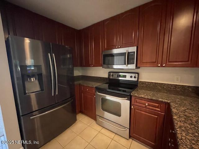 9745 Touchton Rd Unit 2522, Jacksonville, FL 32246 - kitchen featuring stainless steel appliances and light tile patterned floors