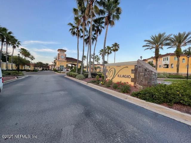 9745 Touchton Rd Unit 2522, Jacksonville, FL 32246 - view of asphalt road featuring curbs and street lights