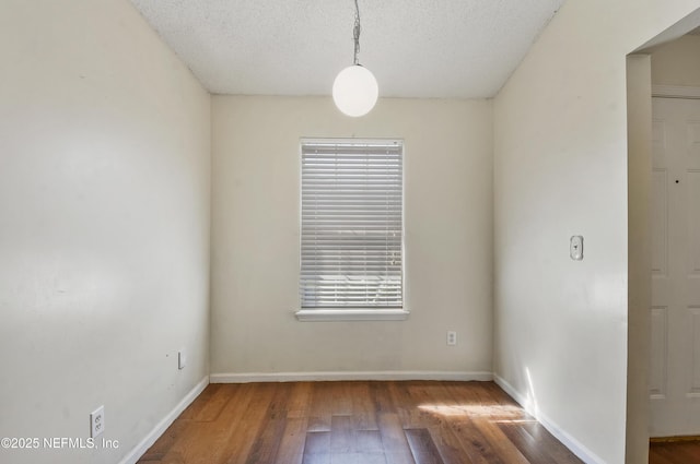 726 Calico Jack Way, Green Cove Springs, FL 32043 - unfurnished room featuring wood finished floors, a textured ceiling, and baseboards